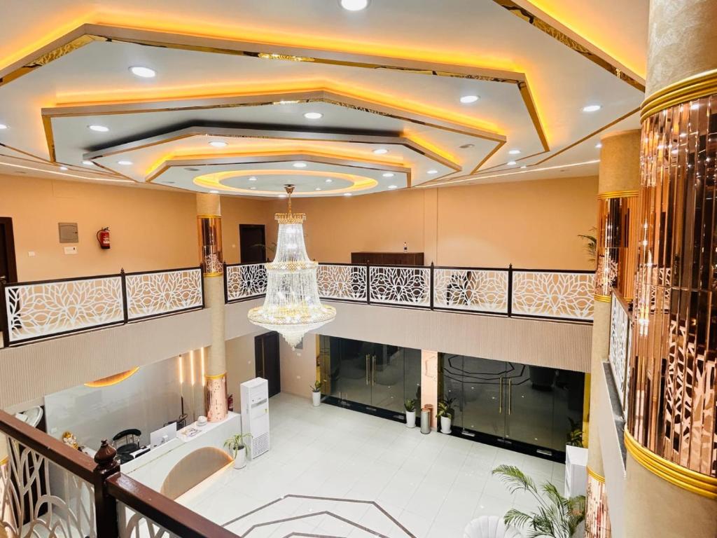 a large lobby with a chandelier in a building at The RK Resort in Siwān