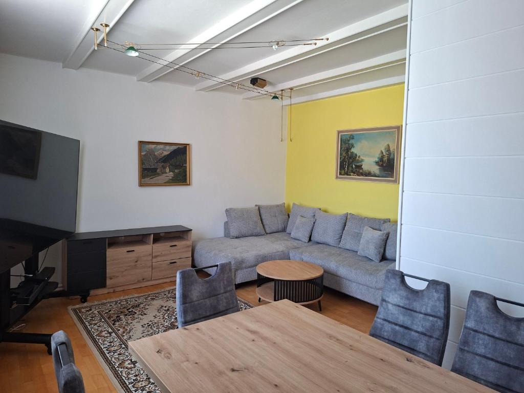 a living room with a couch and a table at BlumentrittAppartment in Sankt Aegyd am Neuwalde
