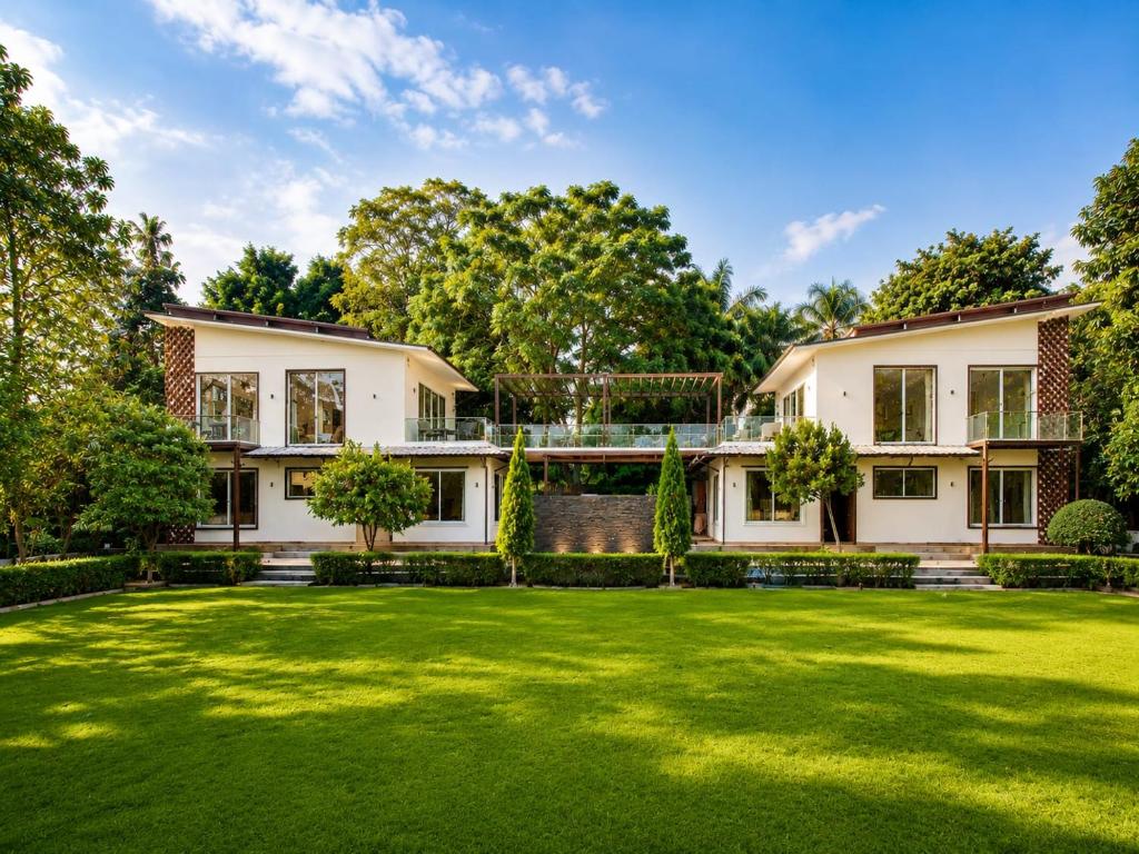 an exterior view of a house with a large yard at Angel Garden Farmhouse in Noida