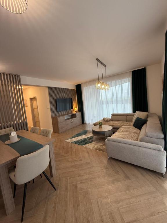 a living room with a couch and a table at TRITA SK - Belanka in Spišská Belá
