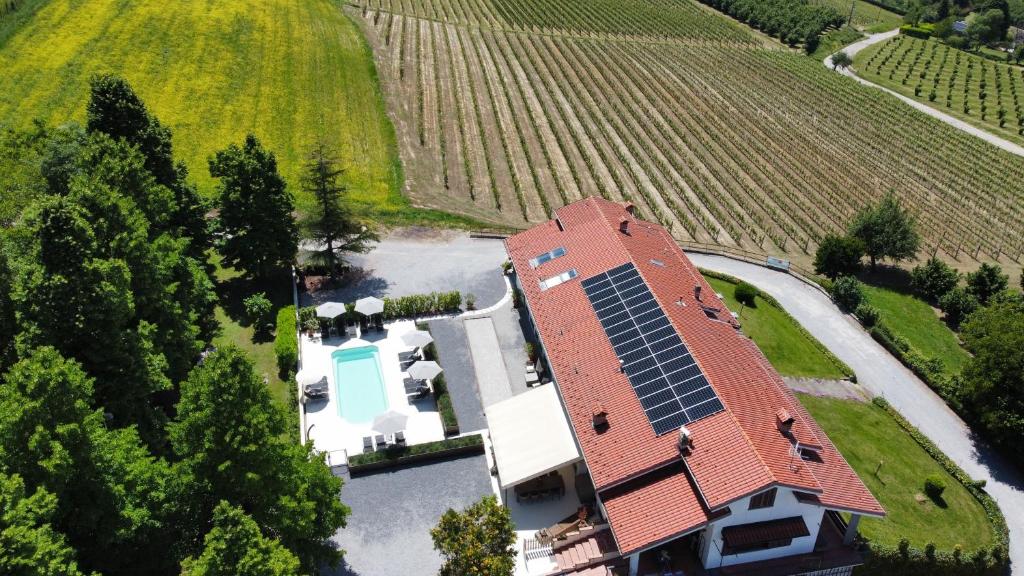 an aerial view of a house with solar panels on it at Casa Alba Blu in Dogliani