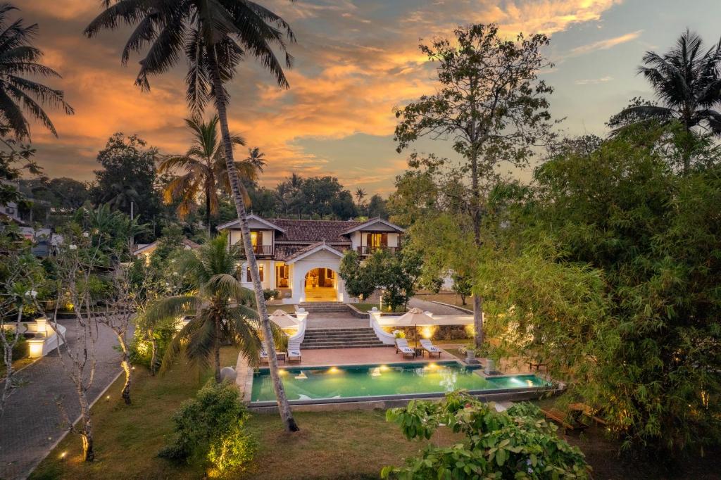 an aerial view of a house with a swimming pool at The Colonial Escape in Galle