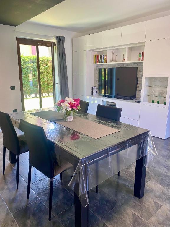 a dining room with a large table and chairs at Casa Sole in Fenis