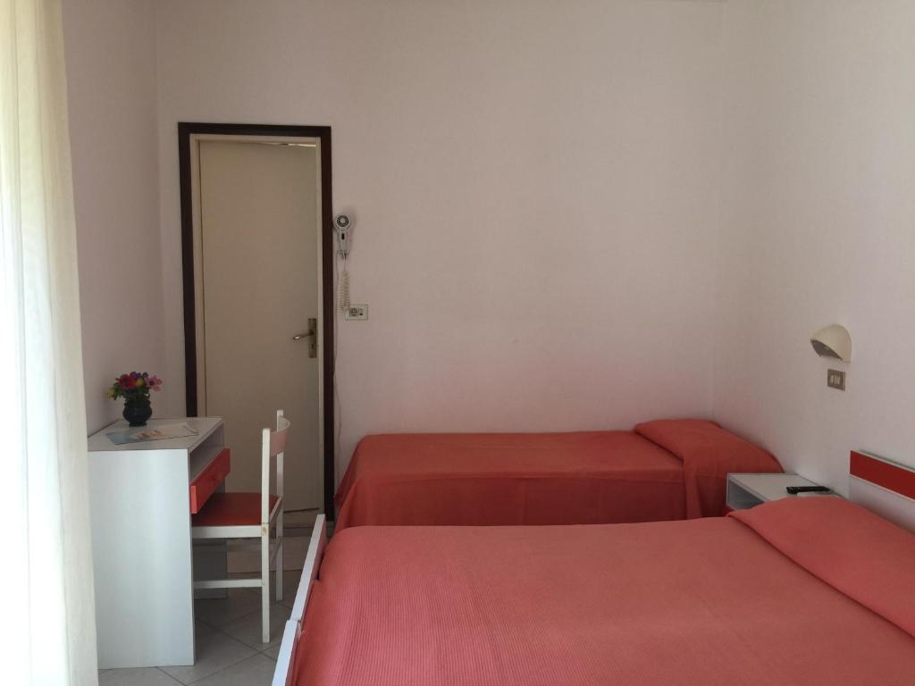 Postel nebo postele na pokoji v ubytování Hotel Calypso