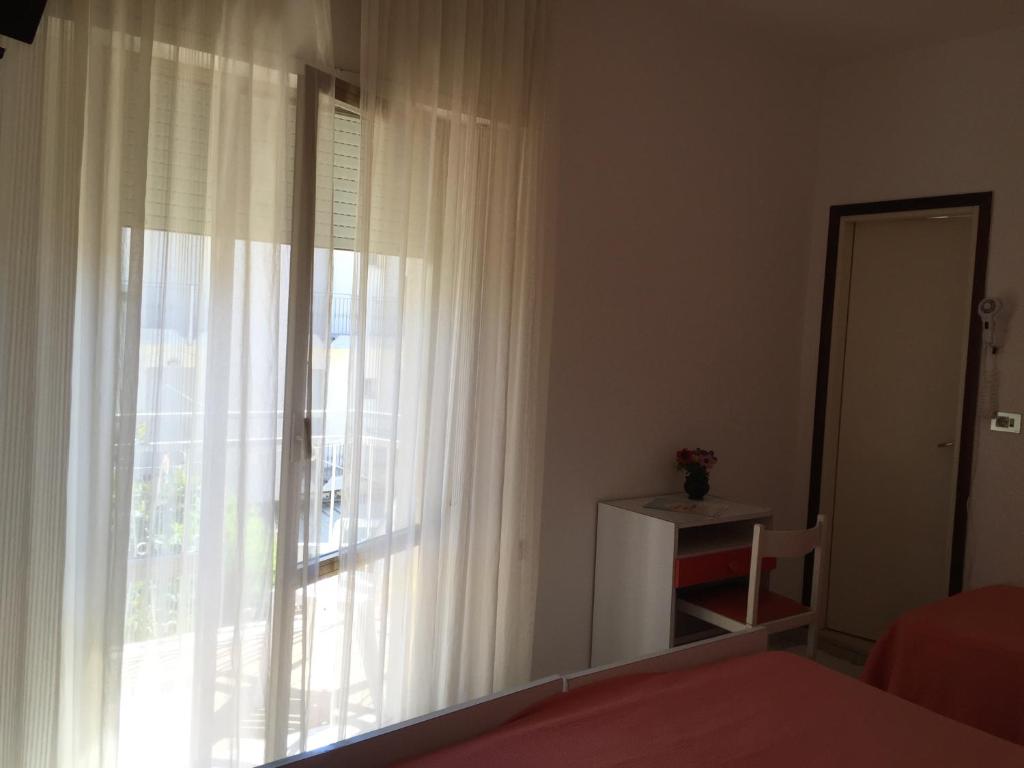 Postel nebo postele na pokoji v ubytování Hotel Calypso