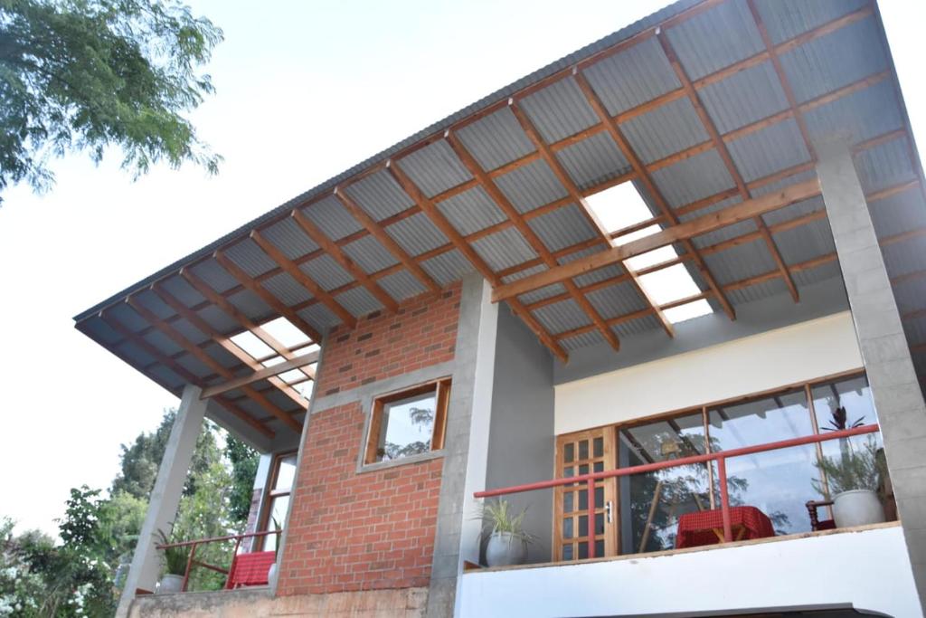 a house with awning on top of it at Camphor Mountain View in Lushoto