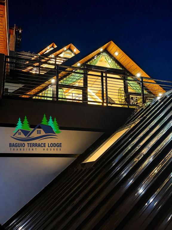 a building with a sign on the side of it at Baguio Terrace Lodge in Baguio