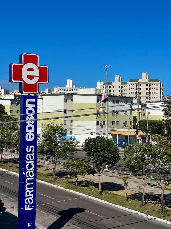 a sign for a gas station on the side of a road at House farol in Aracaju