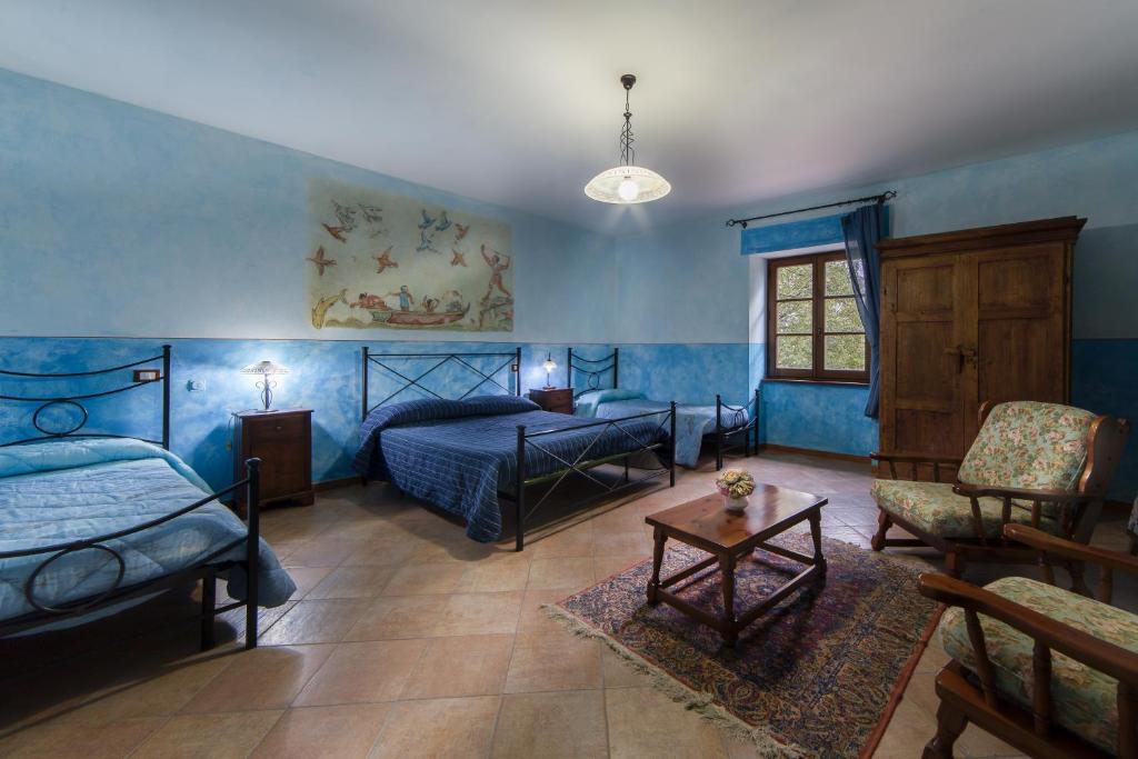 Postel nebo postele na pokoji v ubytování Bio Agriturismo Aia del Tufo