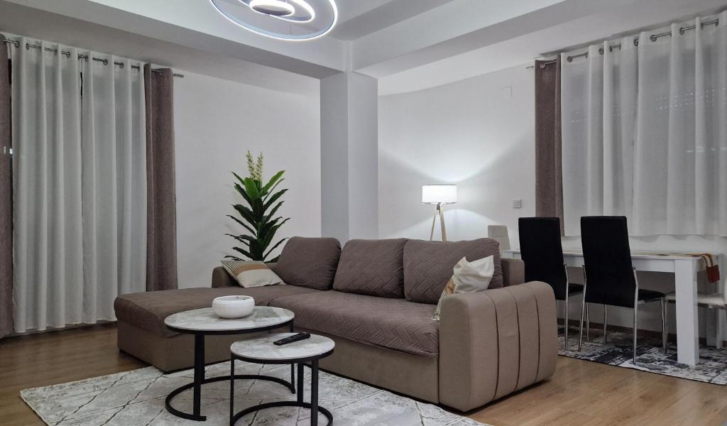 a living room with a couch and a table at Emi Center Apartments in Gevgelija