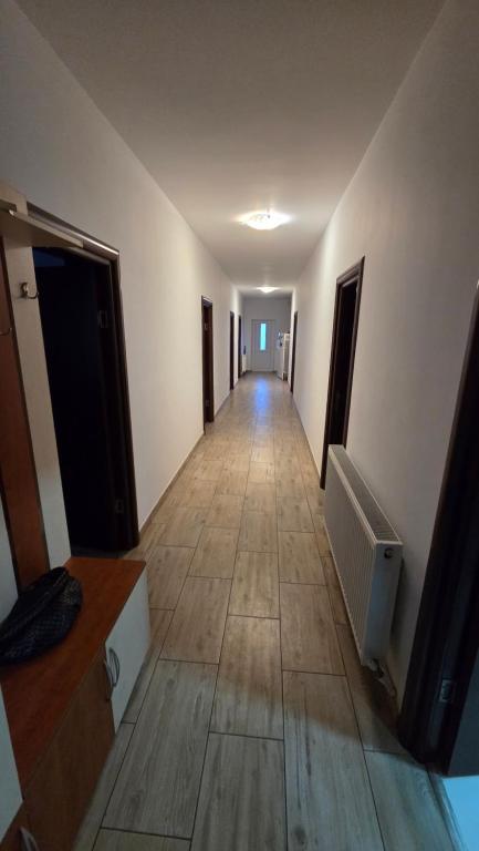 a hallway of an empty room with a hallway at Casă in Năvodari