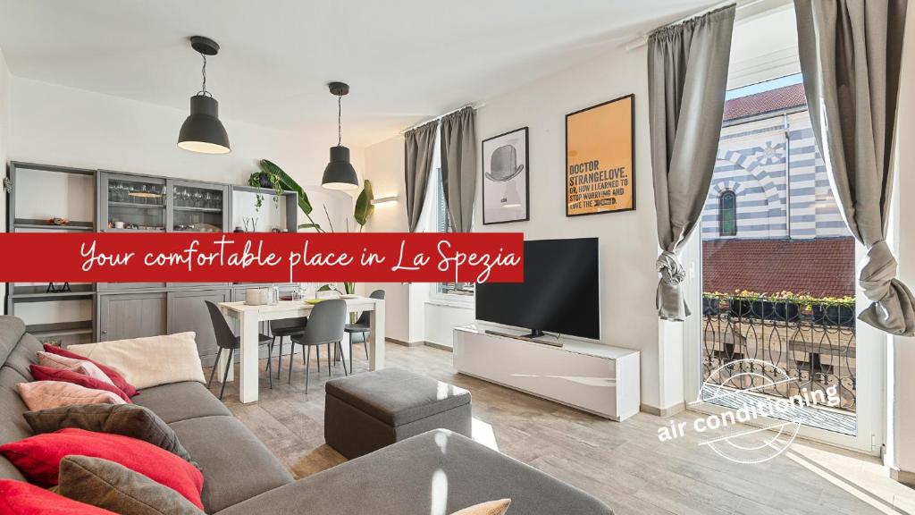 a living room with a couch and a table at Graffiti House Luxury Apartment in La Spezia