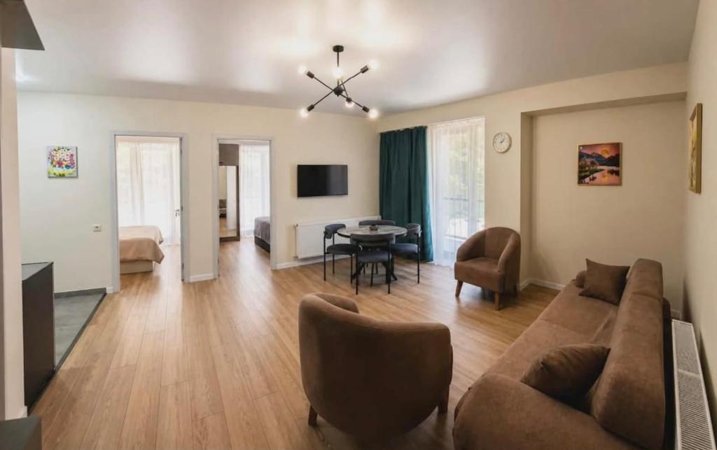 a living room with a couch and a table at Nerse's Apartment in Borjomi