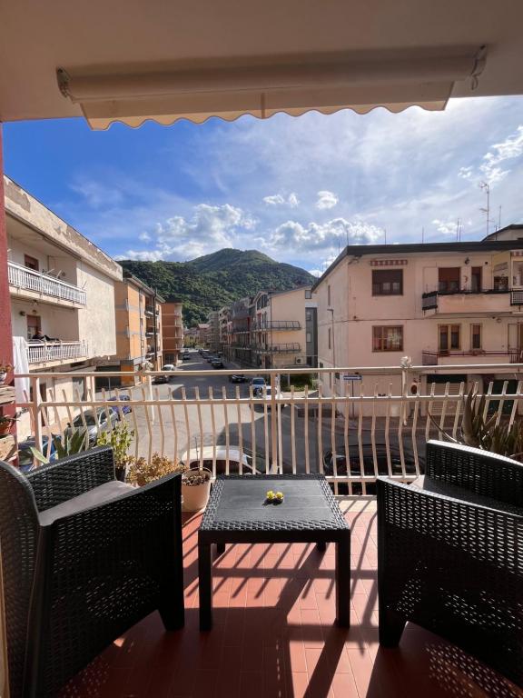 a balcony with a table and chairs and a view at A casa di Filo in Boiano