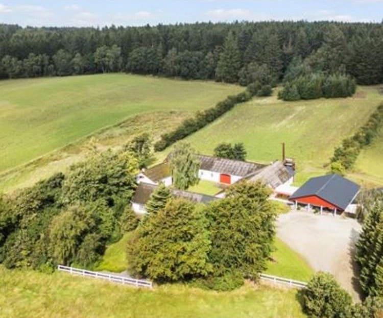 an aerial view of a farm with a barn at Tranum B&B in Brovst