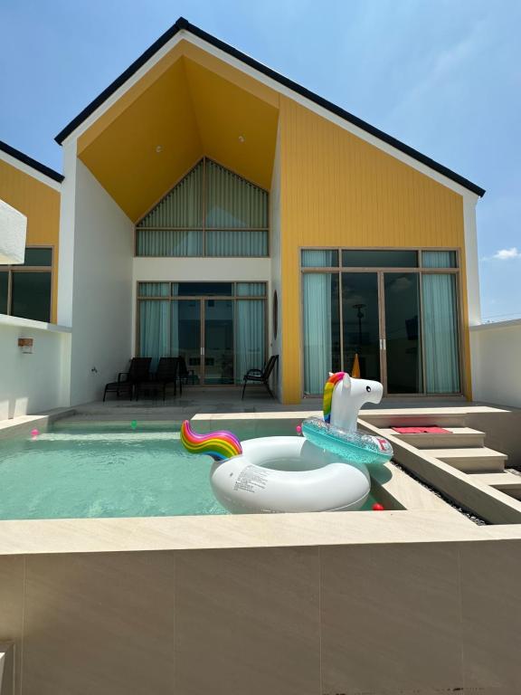 a house with a pool with at Rimna Pool Villa in Hat Yai