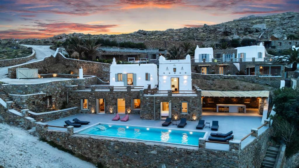 an aerial view of a house with a swimming pool at Villa Evita Panormos private pool & jacouzzi in Mykonos