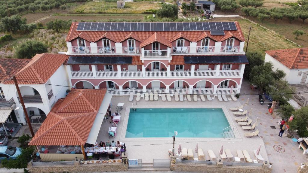 an aerial view of a house with a swimming pool at Giannis Studios in Alykes