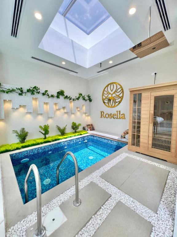a swimming pool in a room with a indoor swimming poolvisor at Rosella Chalet in Jabal Al Akhdar