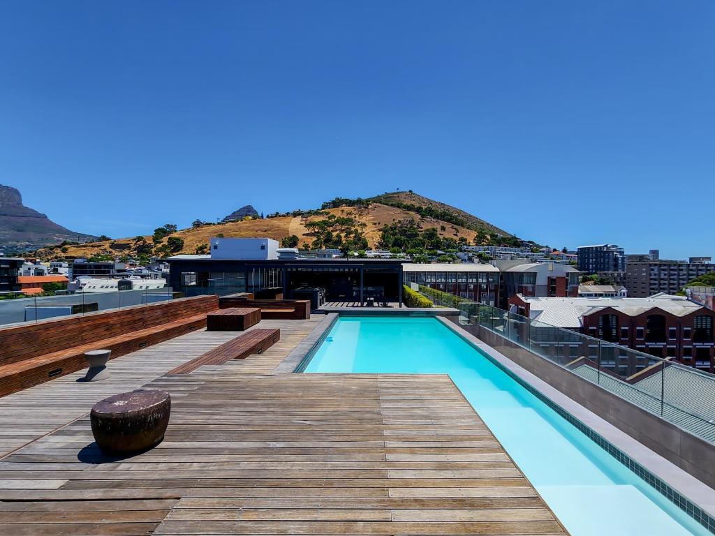 a swimming pool on the roof of a building at The Docklands CT in Cape Town