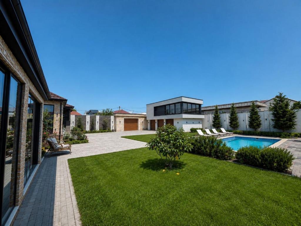 a house with a yard with a swimming pool at PoolSummerHouse in Baku