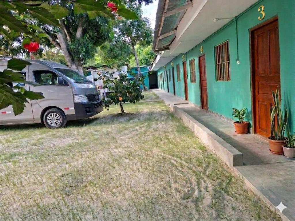 a van parked in front of a building at Casa Hospedaje en Tarapoto in Tarapoto