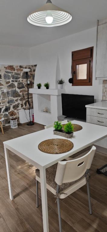 a white table and chairs in a kitchen at Antoni's House Makri in Alexandroupoli