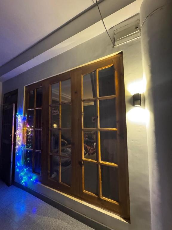 a room with a door with a light on it at kingsgate in Nerul