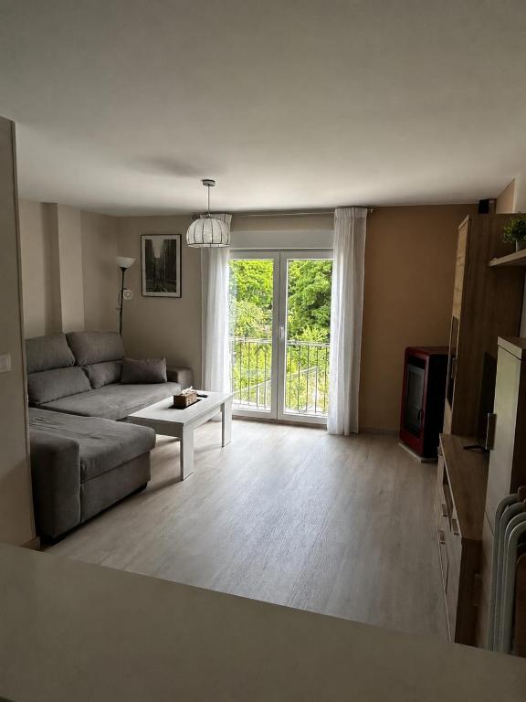 a living room with a couch and a table at Casa Aliseda in Béjar