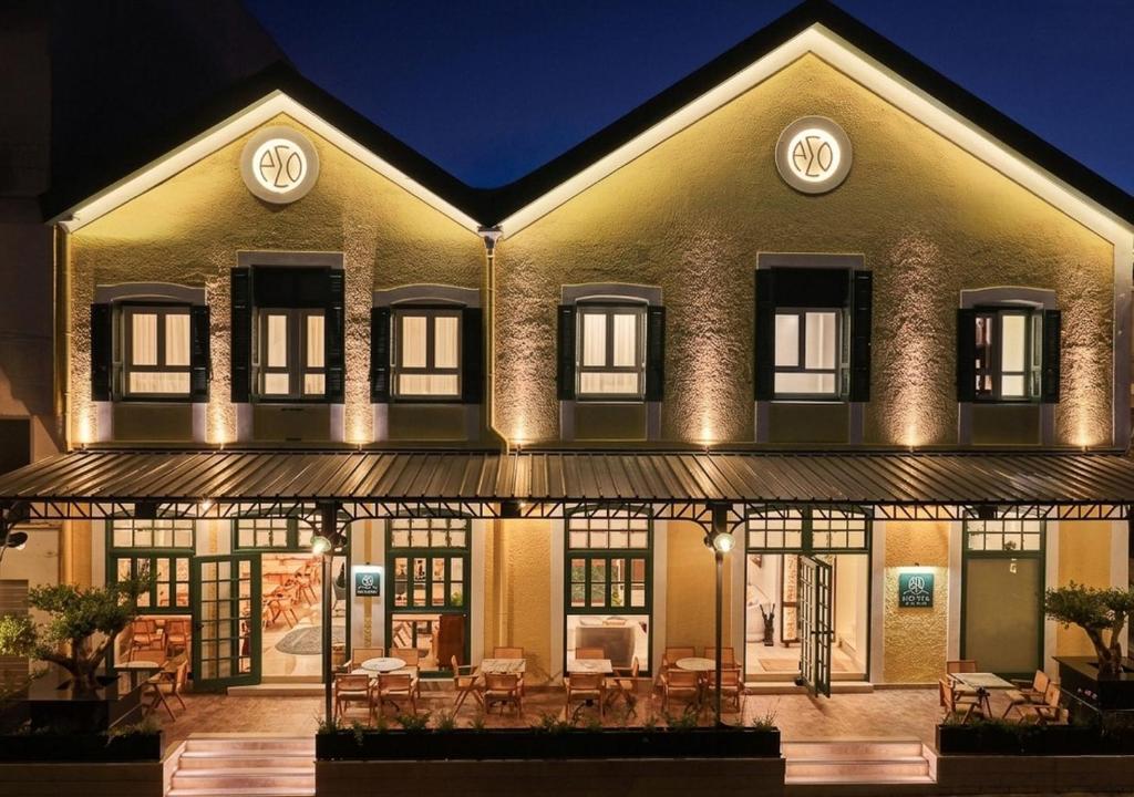 an exterior view of a building at night at ASO Hotel - Historic Raisin Warehouse 1928 in Kalamata