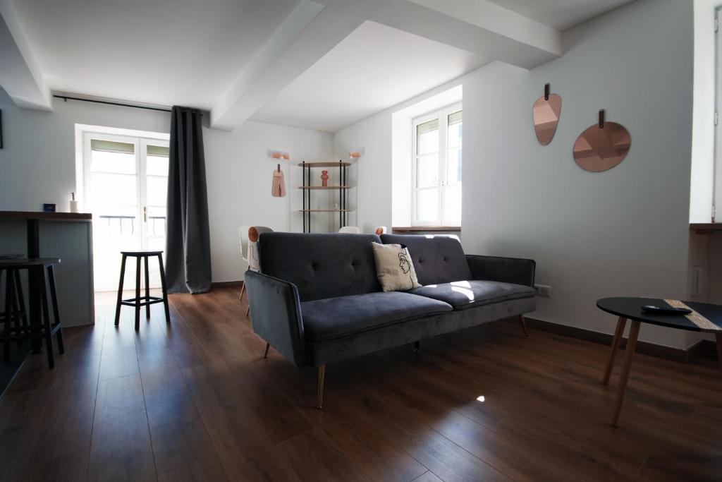 a living room with a couch and a table at Le Duplex in Valence