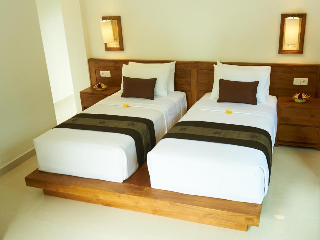 Postel nebo postele na pokoji v ubytování Eden House Ubud