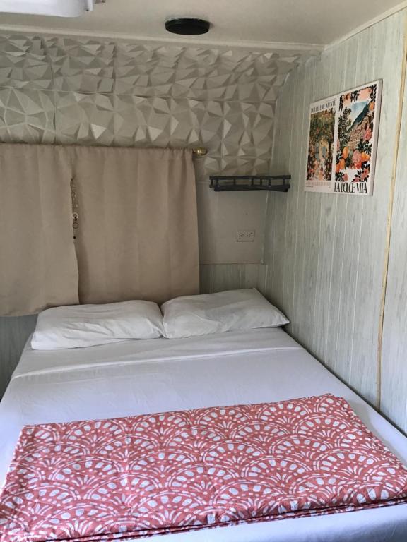 a bed in a small room in a trailer at Tim Vales place in Tampa
