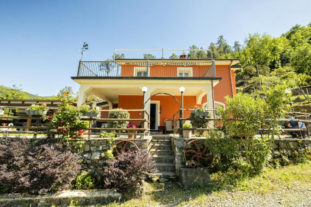 a house with a balcony on top of it at VILLA EMILY in Framura