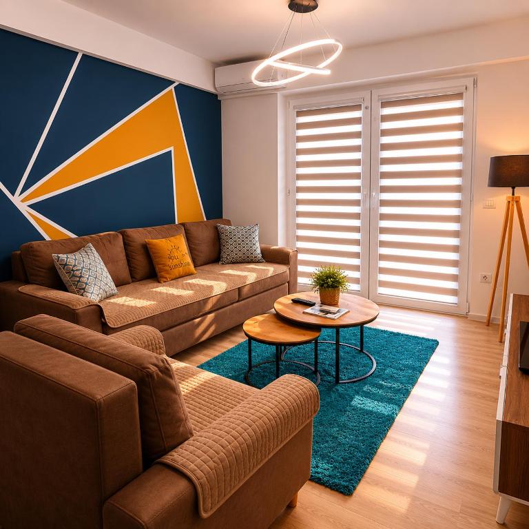 a living room with a couch and a table at Apartment Moki in Skopje