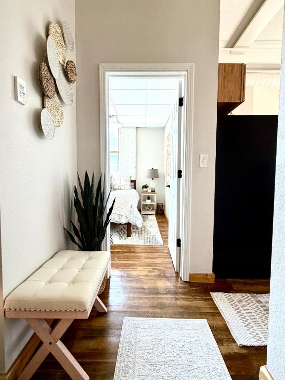 a living room with a bench and a table at Lake Avenue Lofts- Cascade in Duluth