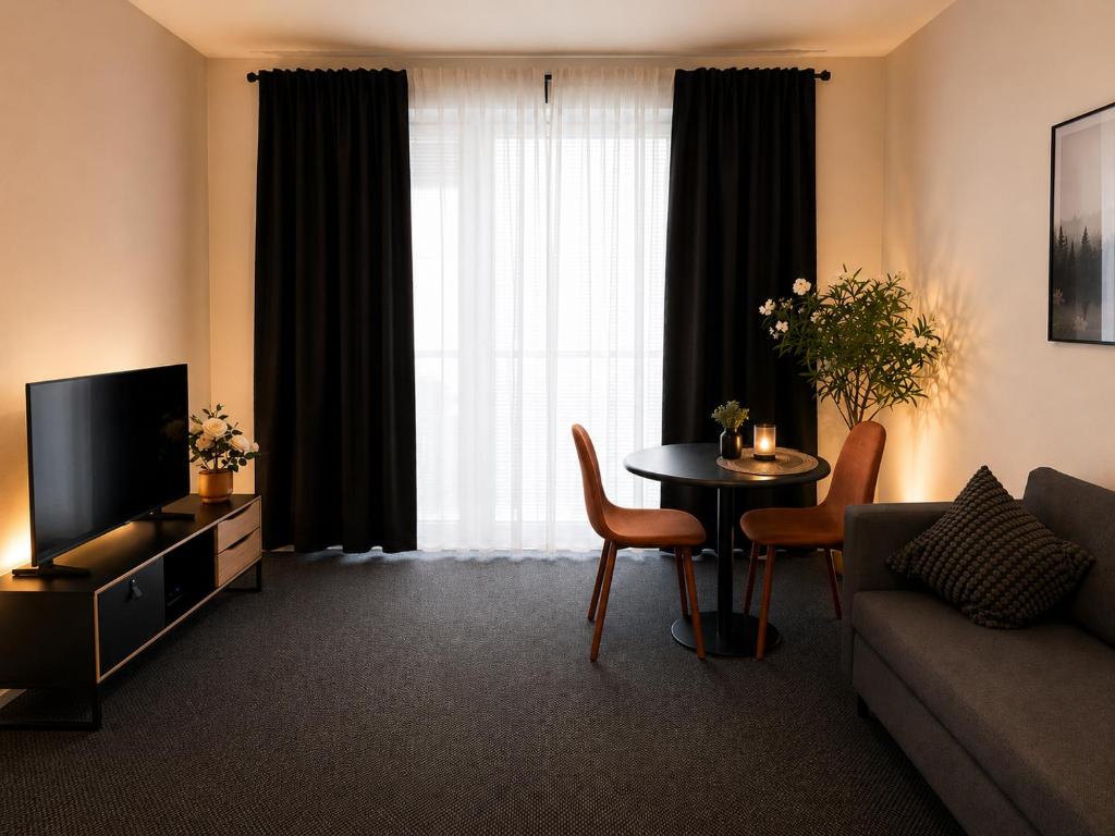 a living room with a couch and a table at Finstay Turku in Turku