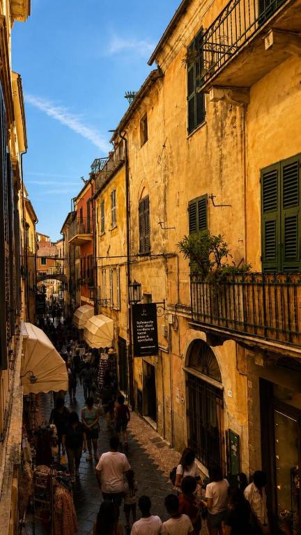 a group of people walking down a street at Casa Garzoglio in Noli