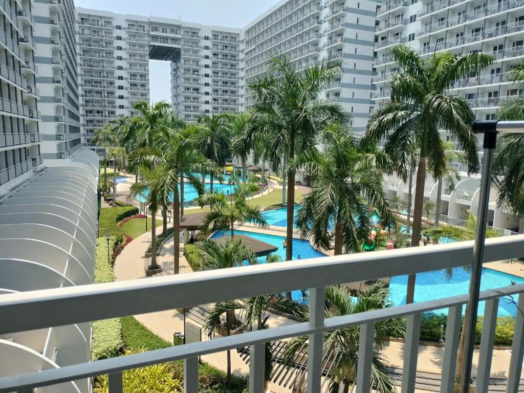 a view of the pool from the balcony of a resort at Estor Staycation in Manila