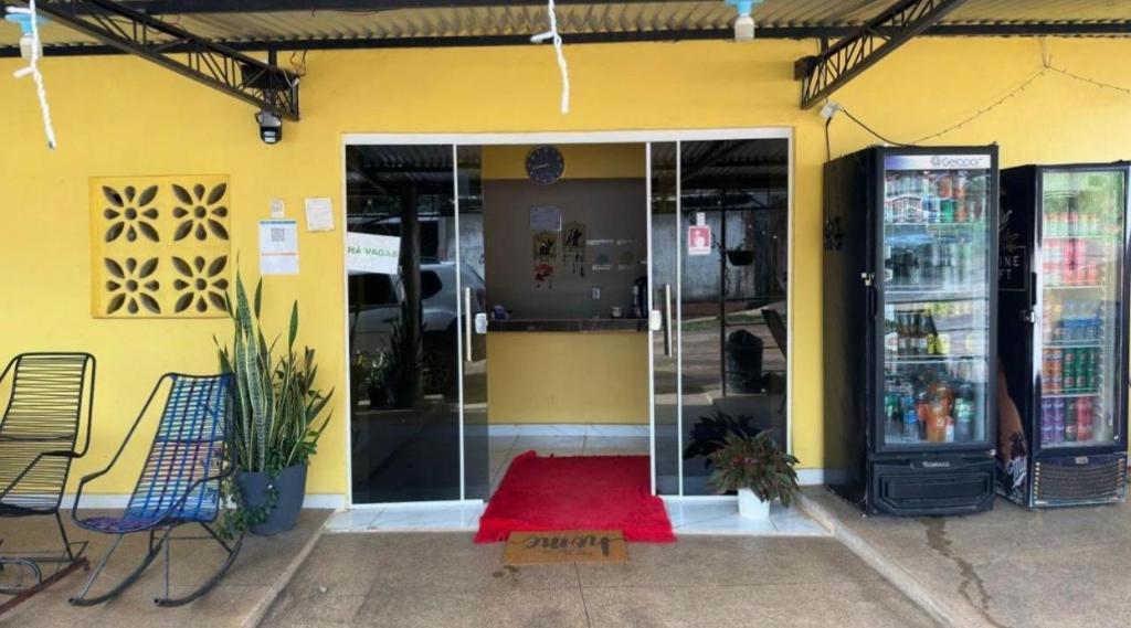 a store front with a red rug in front of it at Pousada recanto da fronteira in Oiapoque