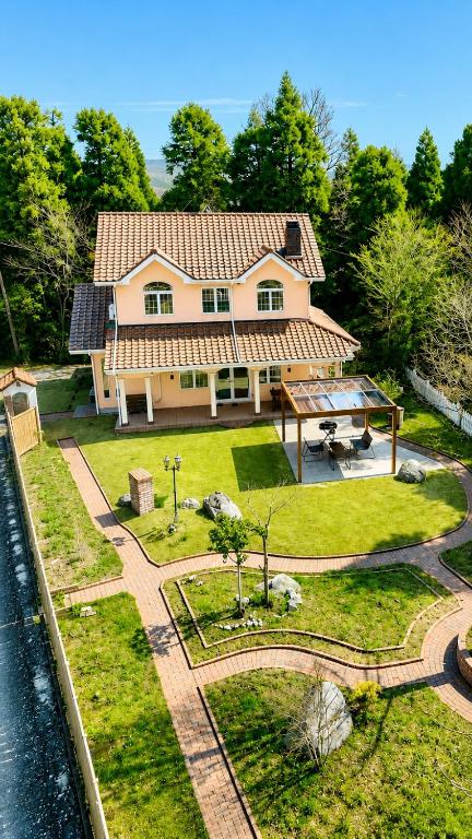 an aerial view of a house with aestead at Star Peak Villa 黒川 in Minamioguni