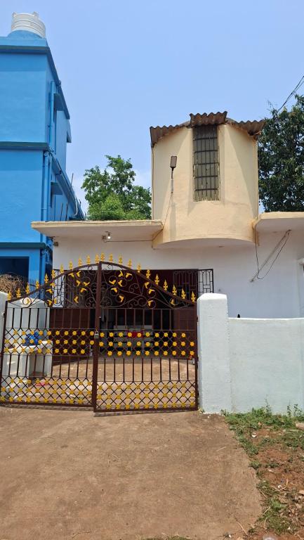 a house with a gate in front of it at Atithi Stay in Bhubaneshwar