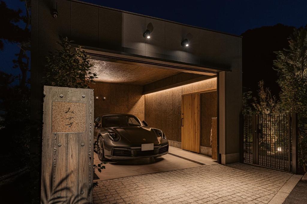 a car parked inside of a garage at night at みささ in Kyonan