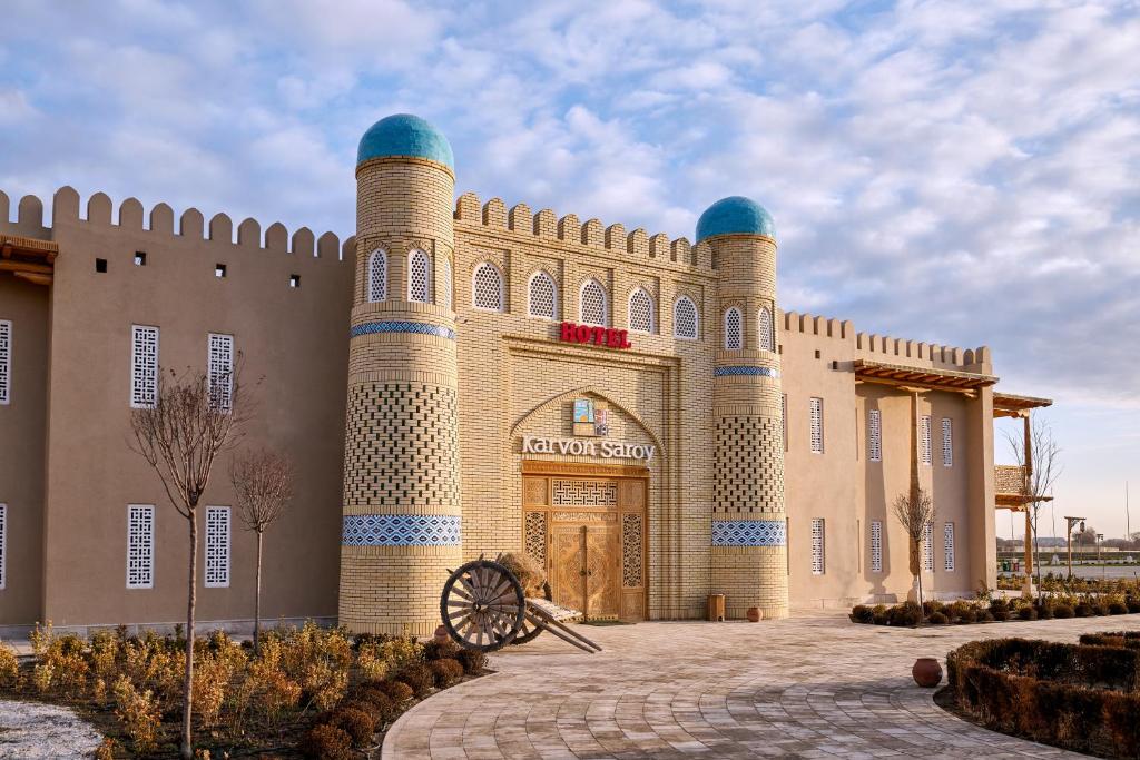 a building with three domes on top of it at Arda Karvon Saroy in Khiva