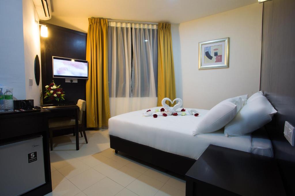 Katil atau katil-katil dalam bilik di Akar Hotel Jalan TAR