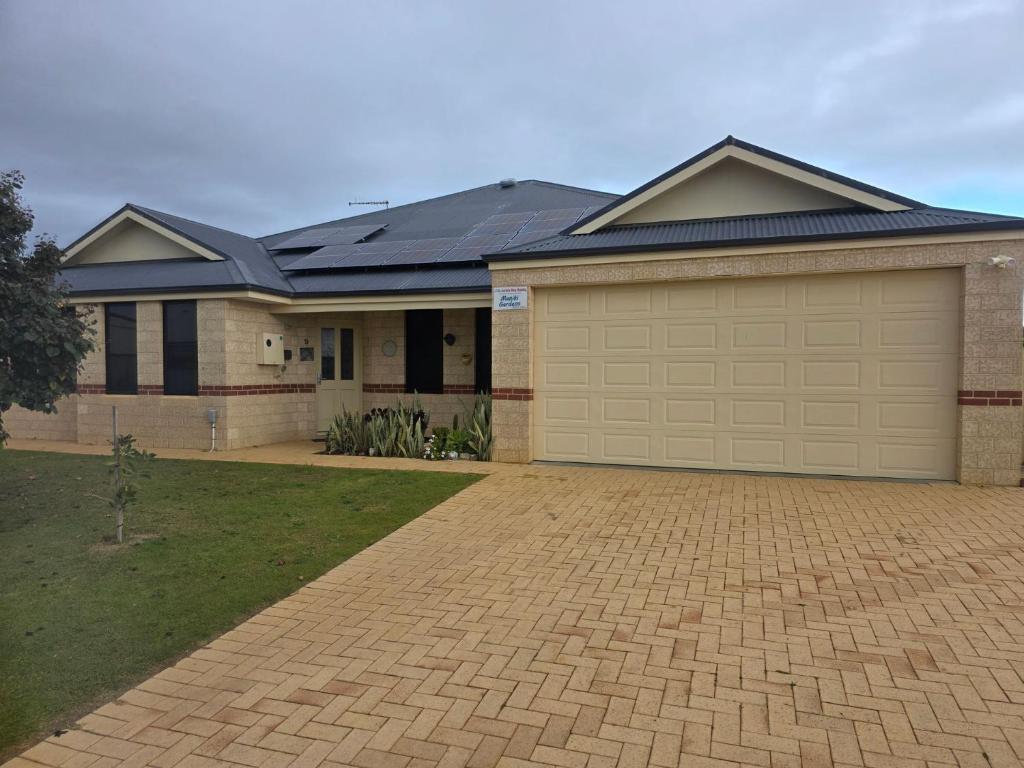a large house with a garage at Maniki Gardens, 9 Maniki Gardens in Jurien Bay