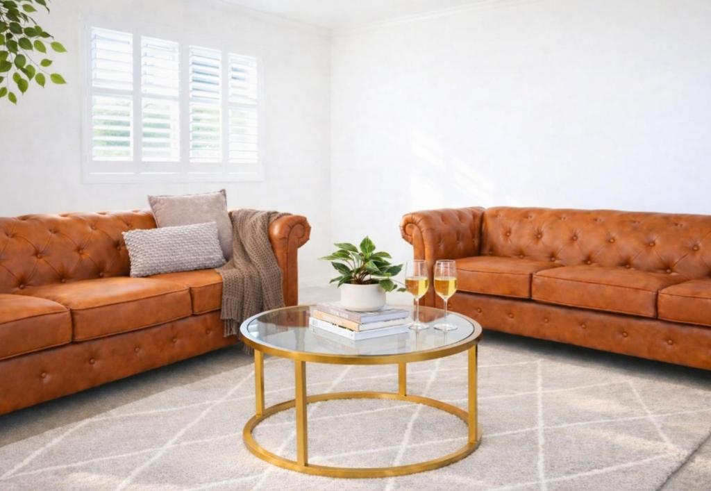 a living room with a couch and a table at The Gables Berry in Berry