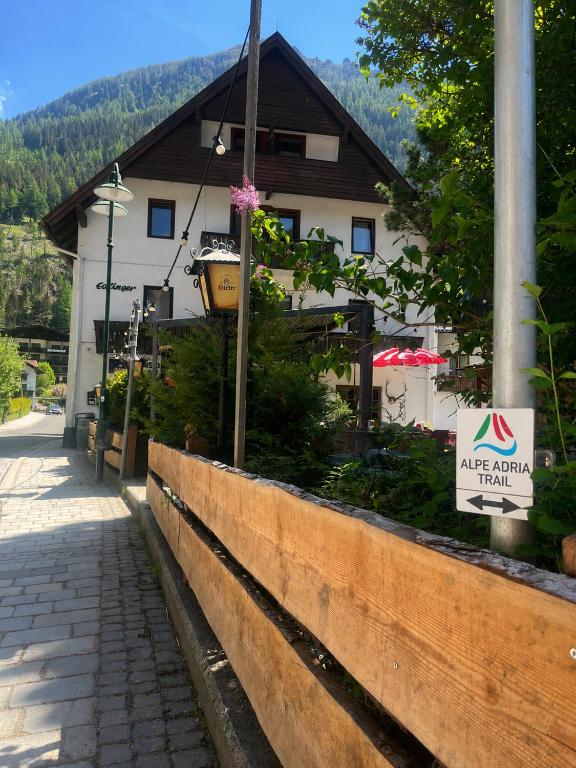 a building with a sign in front of it at Pension Edlinger in Mallnitz