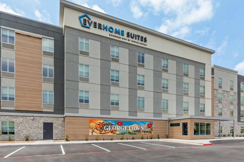 an office building with a sign on the side of it at Everhome Suites Georgetown - Austin in Georgetown