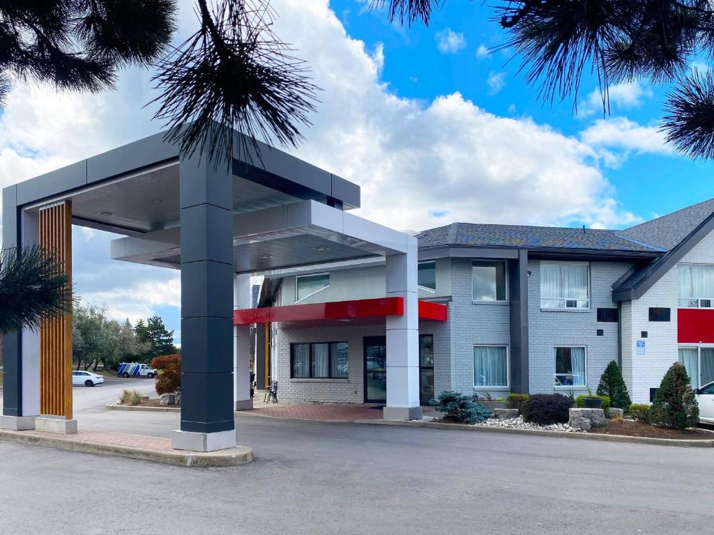 a building with a large entrance in front of it at Comfort Inn Dryden in Dryden